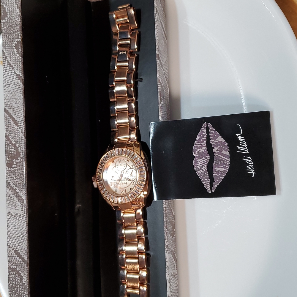 Brand new heidi Klum wildlife gold tone watch